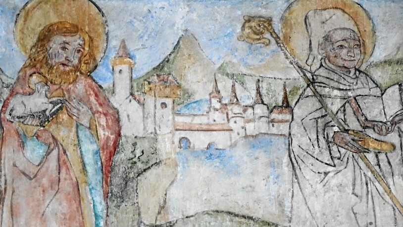 In der Kirche Fideris werden Johannes der Täufer und der heilige Gallus vor einer Stadtkulisse dargestellt.