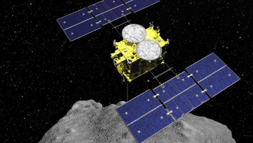 Computer-Grafik, die den Abwurf einer Sprengbombe von der Raumsonde Hayabusa2 auf den Asteroiden Ryugu zeigt. Die heikle Sprengung am 5. April verlief erfolgreich.