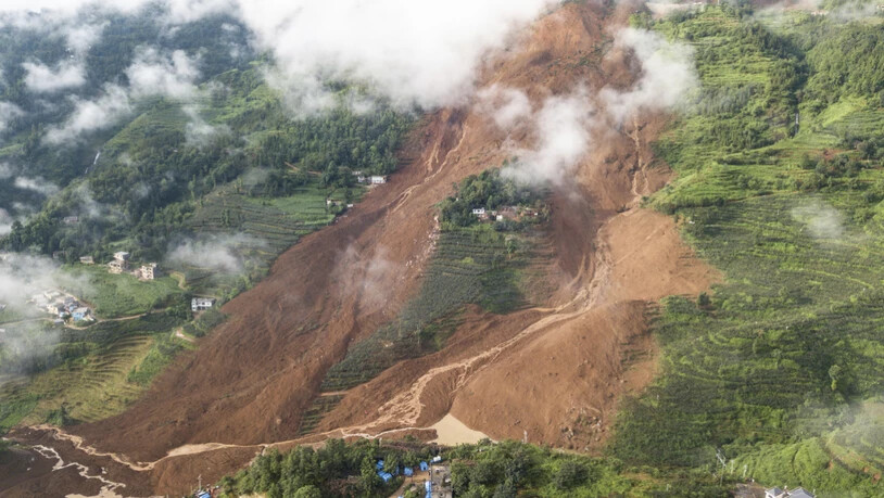 Der massive Erdrutsch beim Dorf Pingdi in der chinesischen Provinz Guizhou forderte mindestens 13 Todesopfer.