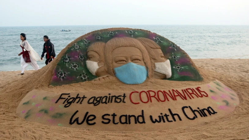 Solidaritäts-Sandskulptur des indischen Künstlers Sudarsan Pattnaik für China. Im Reich der Mitte ist die Corona-Pandemie extrem verniedlicht worden, wie eine neue Studie beweist. (Symbolbild)
