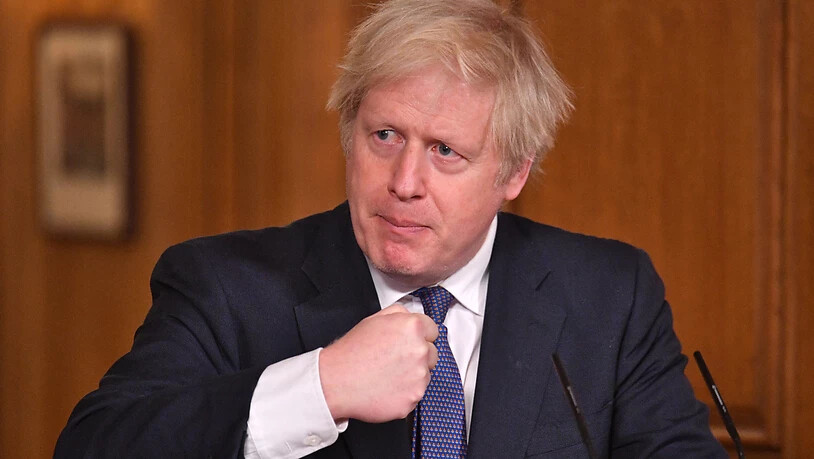 Boris Johnson, Premierminister von Großbritannien, gestikuliert in der Downing Street bei einer Pressekonferenz zur Corona-Pandemie. Foto: Dominic Lipinski/PA Wire/dpa