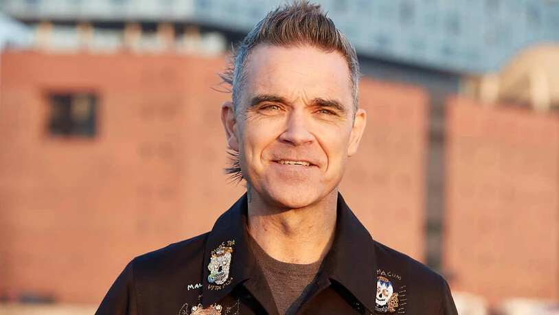 Robbie Williams, britischer Sänger und Songwriter, will auf jeden Fall die Fußball-WM verfolgen. Foto: Georg Wendt/dpa
