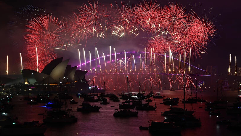 The midnight fireworks are seen over the Sydney Opera House and Sydney Harbour Bridge during New Years Eve celebrations in Sydney, Sunday, January 1, 2023. (AAP Image/Bianca De Marchi) NO ARCHIVING