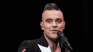 Der britische Popstar Robbie Williams kommt im Januar ins Zürcher Hallenstadion. Mit seiner Show "XXV" feiert er das 25-Jahre-Jubiläum seiner Solokarriere. (Archivbild)