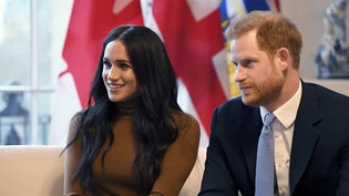Prinz Harry und seine Frau Meghan am Dienstag in London - am Mittwoch erklärten sie, sie wollten sich aus der ersten Reihe der Royals zurückziehen.